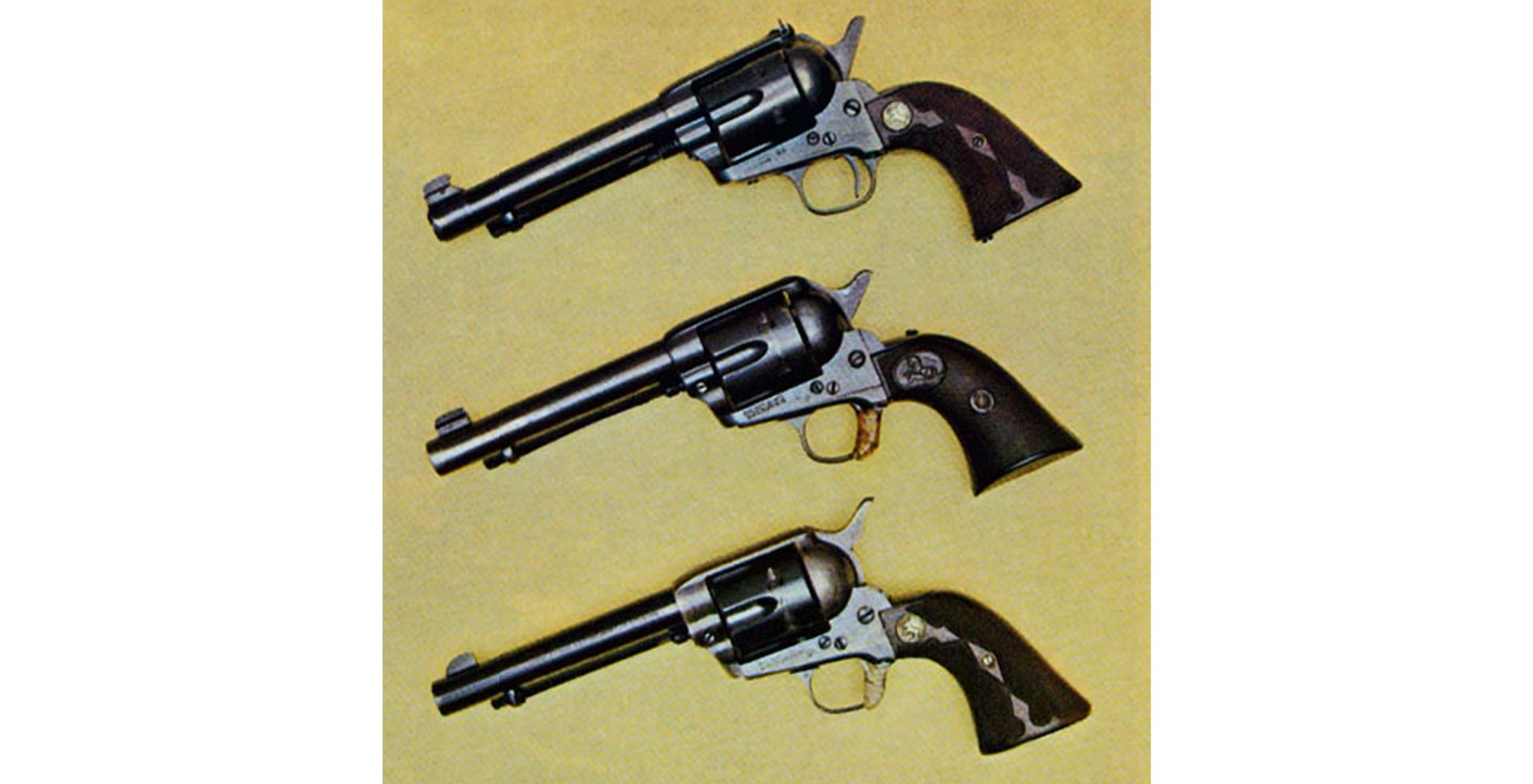 Three McGivern Colt Single-Actions include (top to bottom): .45 with S&W target sights and two .38 Specials with triggers taped. Center gun has slip hammer, while lower gun with smoothed hammer bears markings "Ed McGivern's Fanning Gun".