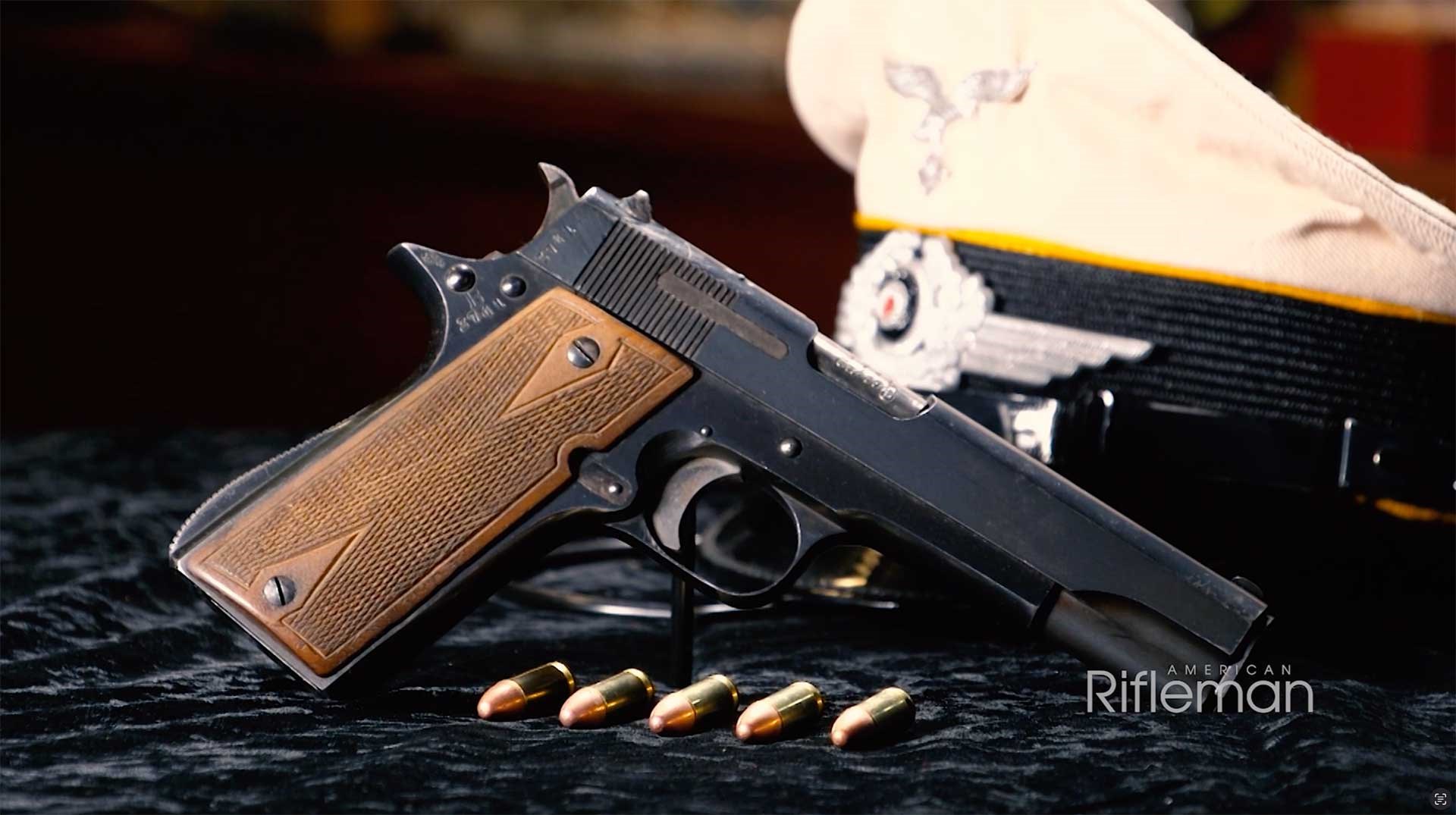 Right side of the Star Model B propped up in front of a white military cap.