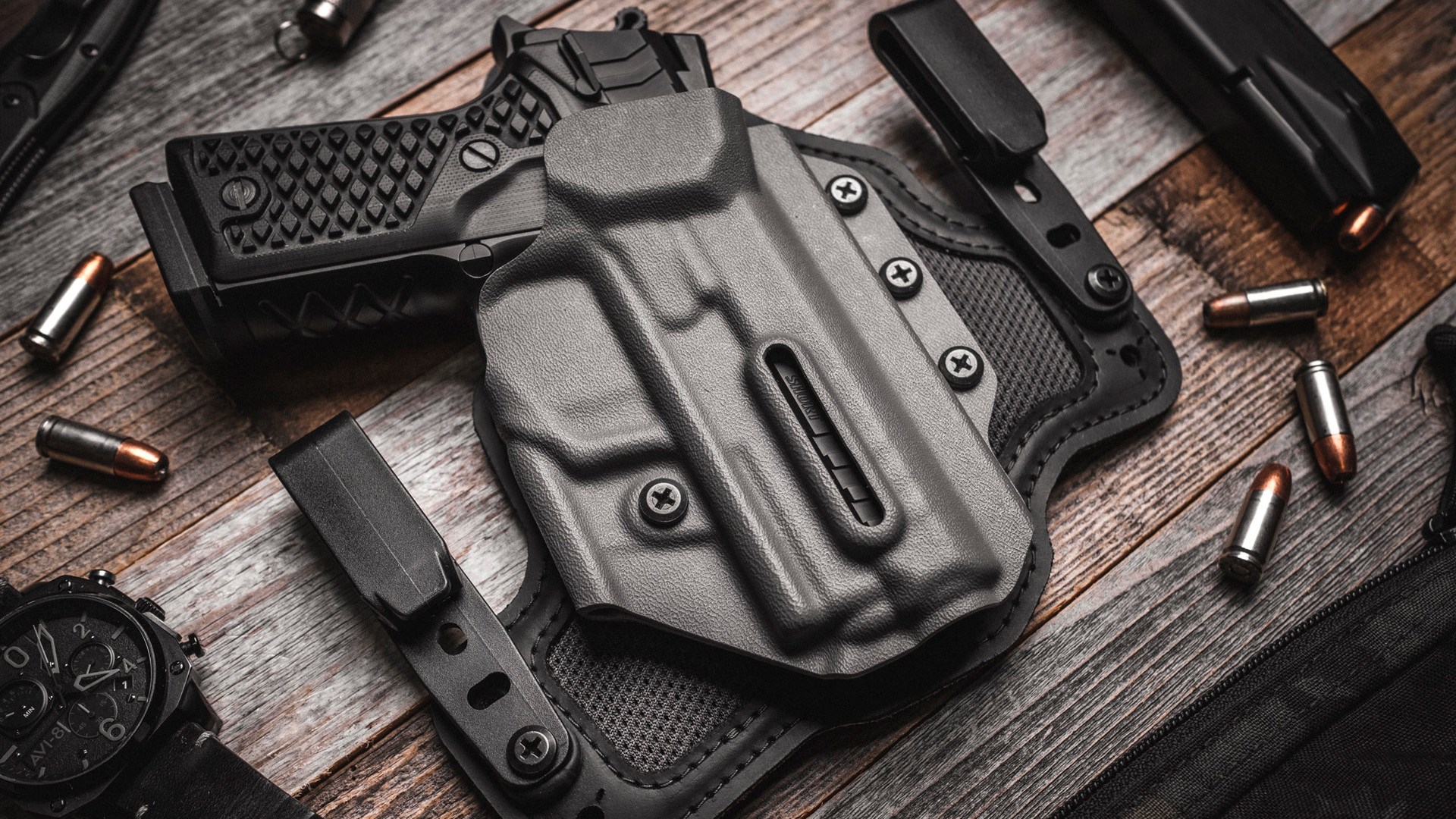 Lionheart Vulcan 9 shown inside a holster surrounded by loose rounds and loaded magazines.