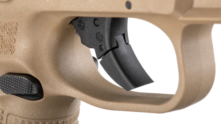 Close-up view of handgun trigger.