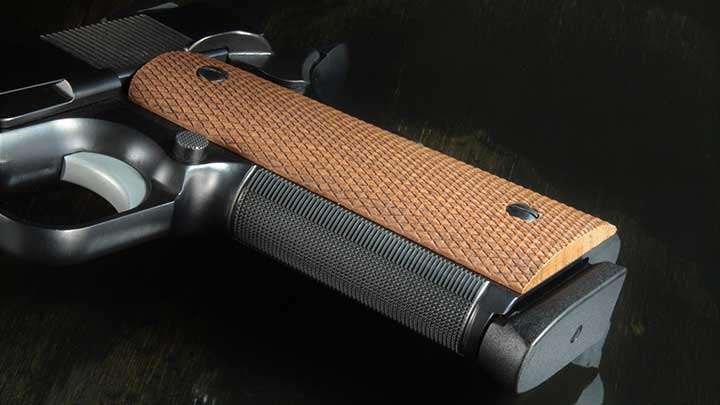 A view of the grips and checkered front strap on the Alchemy 1911.