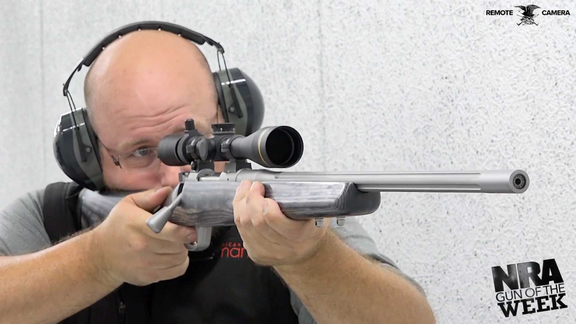 man earmuffs glasses shooting rifle gun target shooting