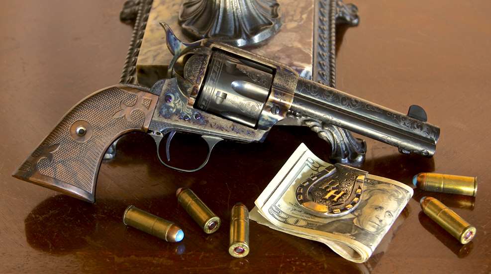 Standard Manufacturing Single Action revolver shown on bedstand with lamp base bullets ammo money
