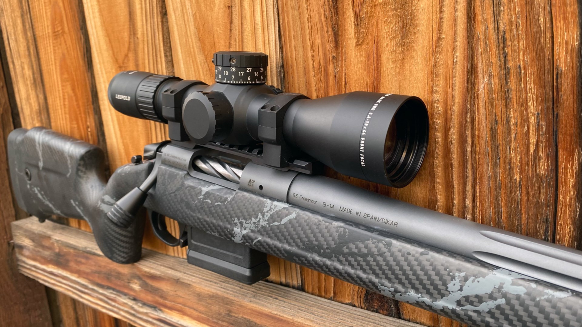 Bergara B-14 Squared Crest bolt-action rifle shown on fence with Leupold riflescope optic attached
