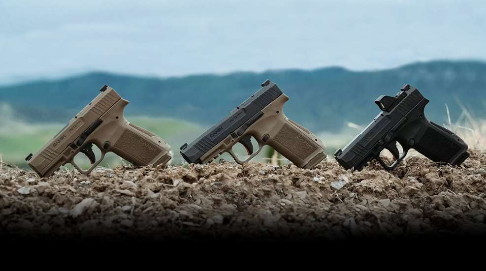 Three canik pistols row outdoors gravel mountain background