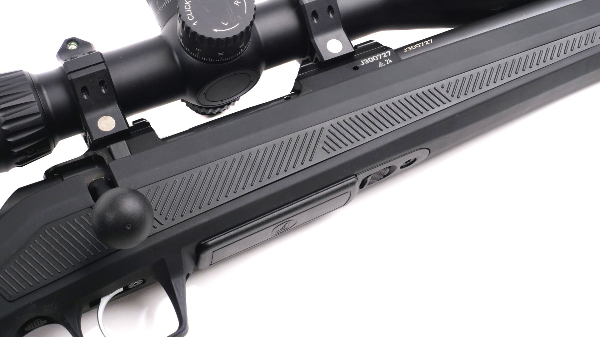 CZ 600 bolt-action rifle right-side closeup of action with bolt knob trigger magazine black stock and riflescope in view on white background