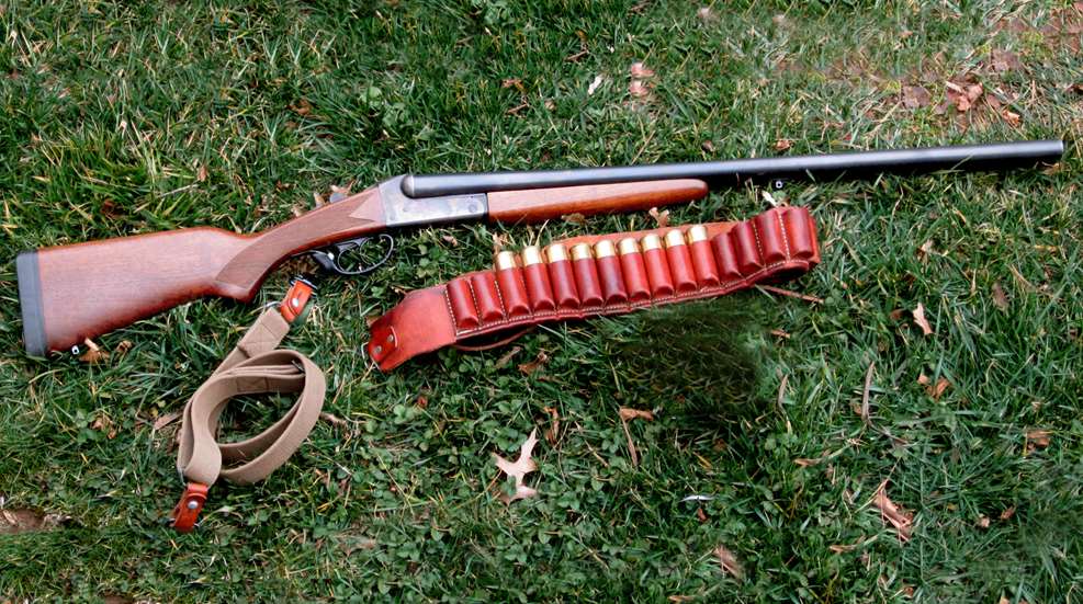 Country Time Stevens gun shotgun outdoors moss grass gun metal wood leather ammunition