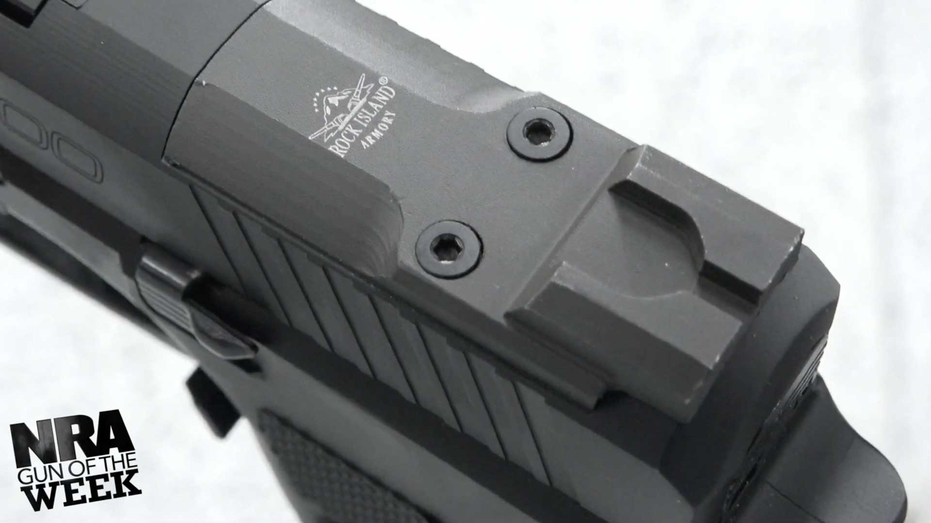 handgun pistol gun metal parts slide optic plate rear sight with text on image noting "NRA GUN OF THE WEEK"