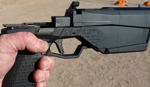 silencened maxim pistol semi-auto 9 mm in hand