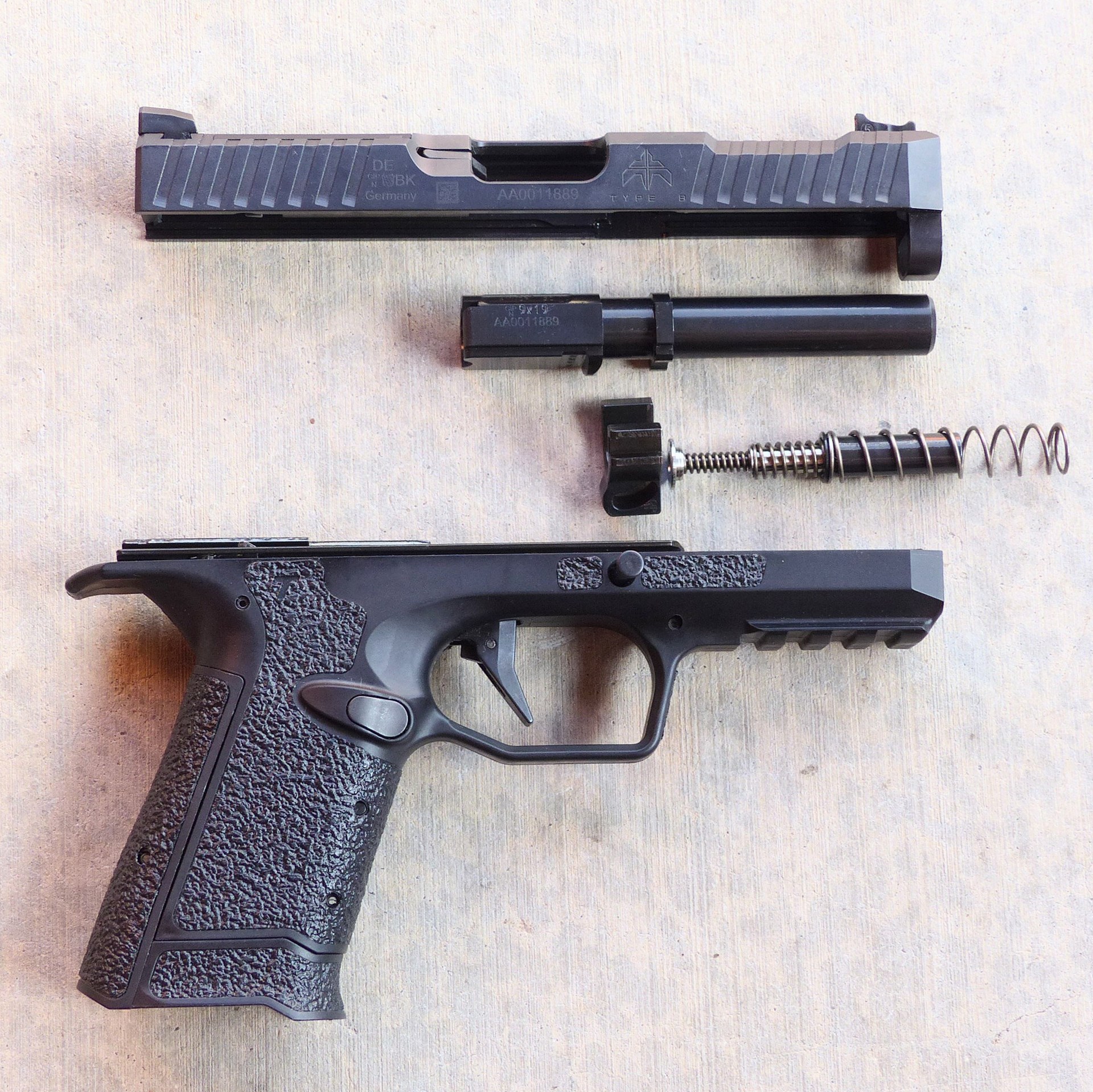 Archon Type B right-side view field stripped disassembled slide barrel spring frame