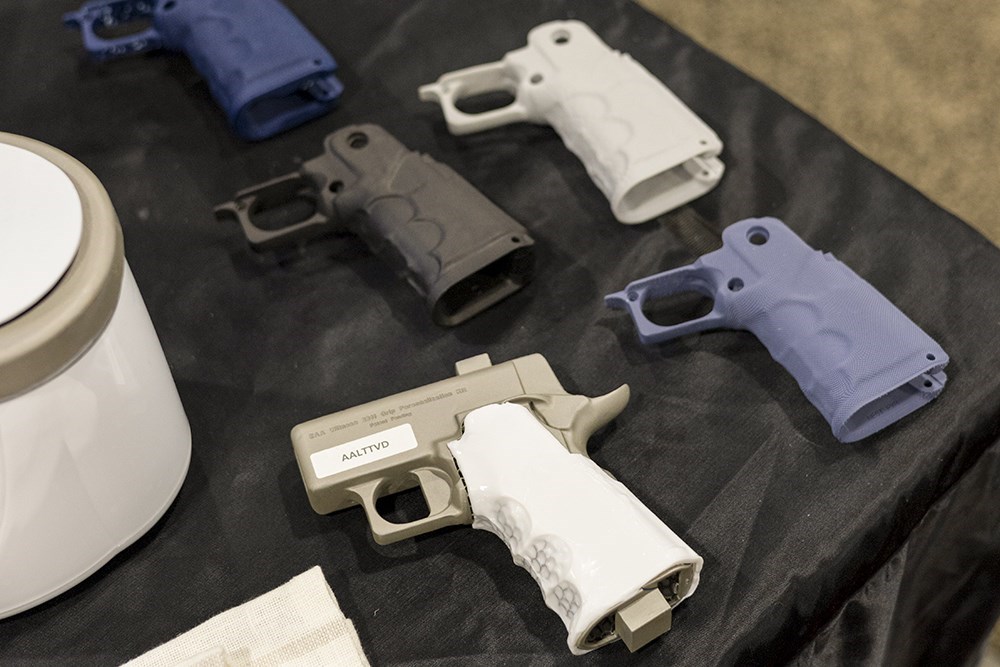 grip assemblies for 2011-style pistol various colors on black table