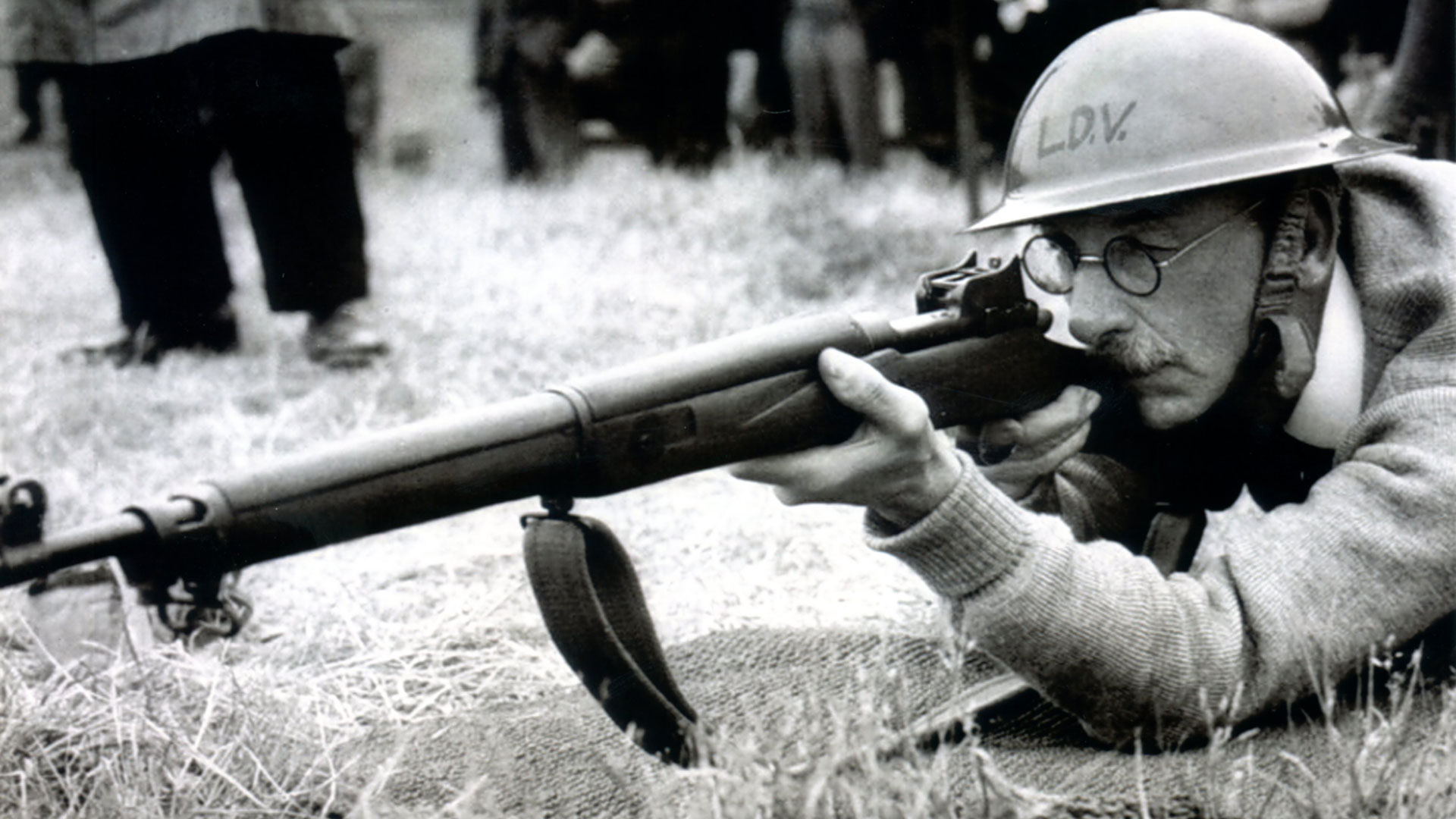 Prior to consolidation into the Home Guard, many units were organized as Local Defense Volunteers (LDV).  This bespectacled veteran practices with a British P14 rifle in .303 Brit.  NARA