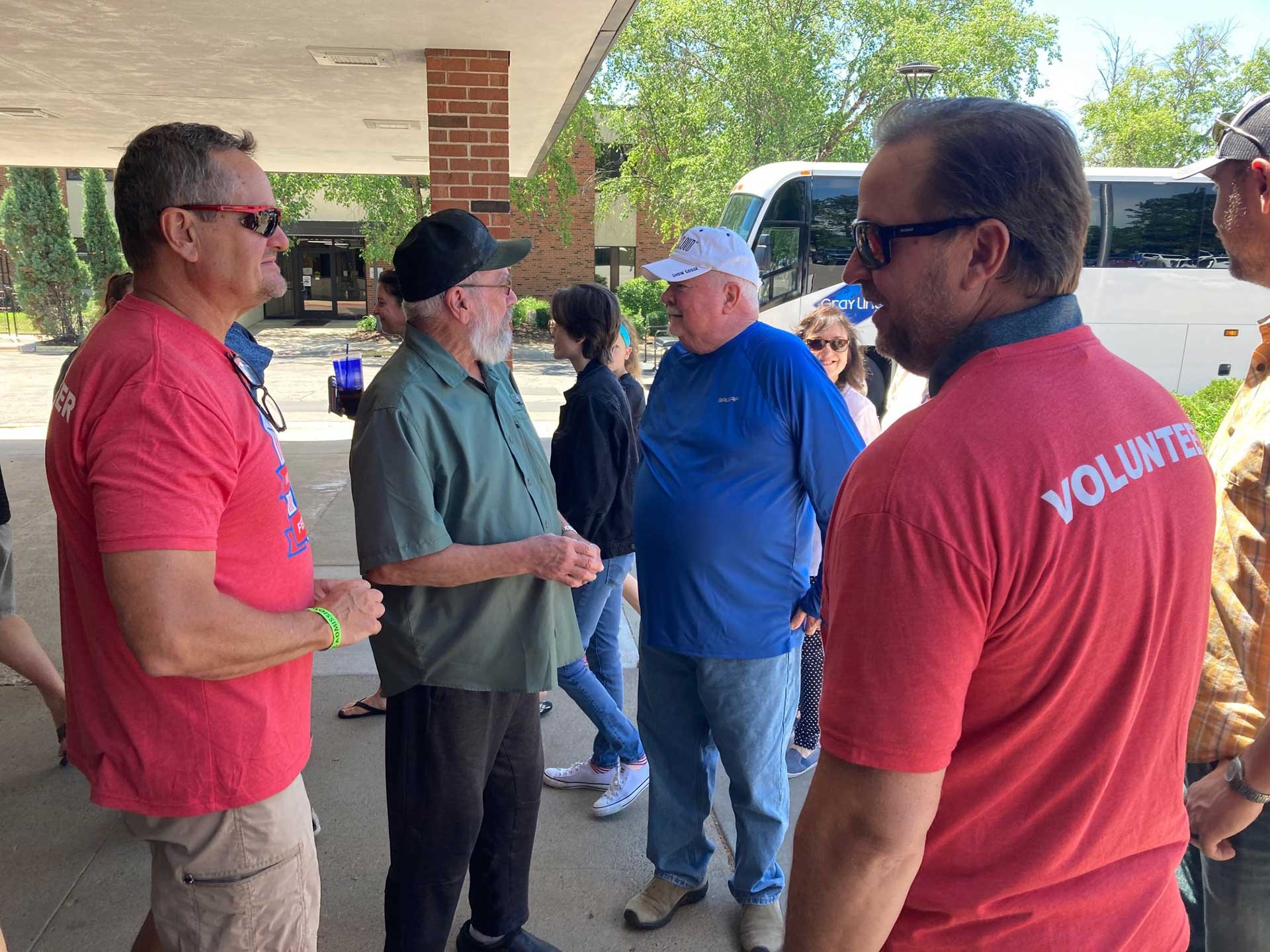 Rick Stoeckel (l.) and Drew Goodlin greet guests at Federal Ammunition's 100th anniversary celebration.