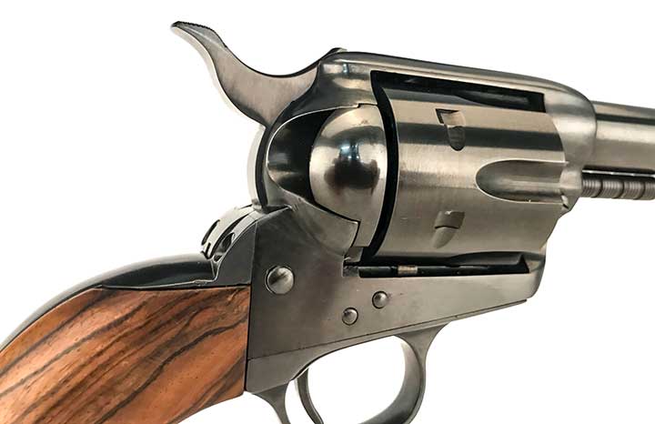 Colt Single-Action Army, right side, showing cylinder and ejection port on white.