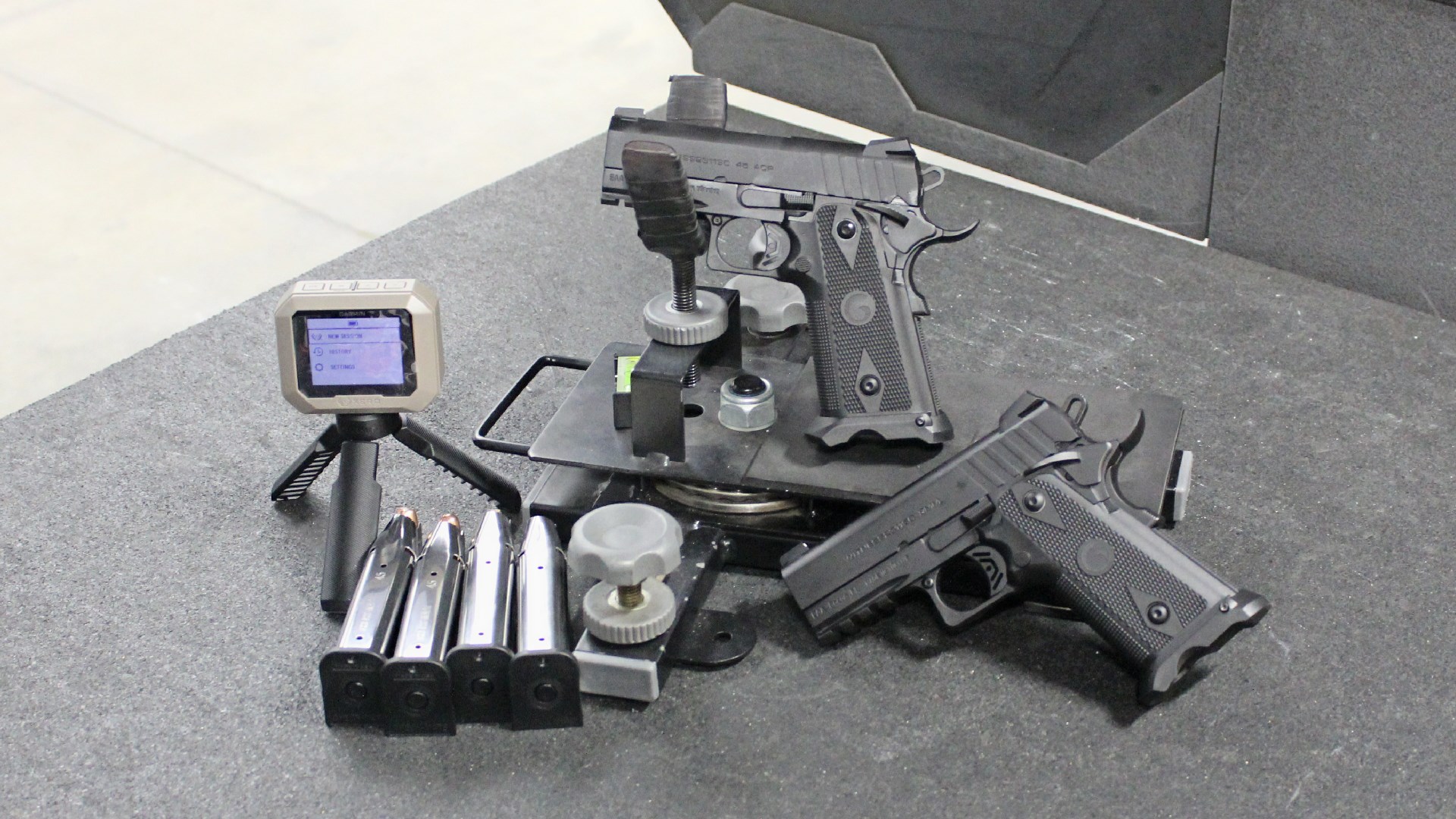 EAA Brat Witness2311SC guns on range with support cradle ammunition magazines and garmin chronograph