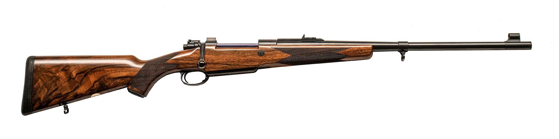 Full-length .416 Rigby magazine rifle shown on white, right side.