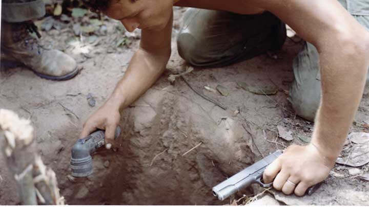 A “Tunnel Rat” of the 25th Infantry Division prepares to enter a VC tunnel near Cu Chi in the Hobo Woods during Operation Cedar Falls in January, 1967.