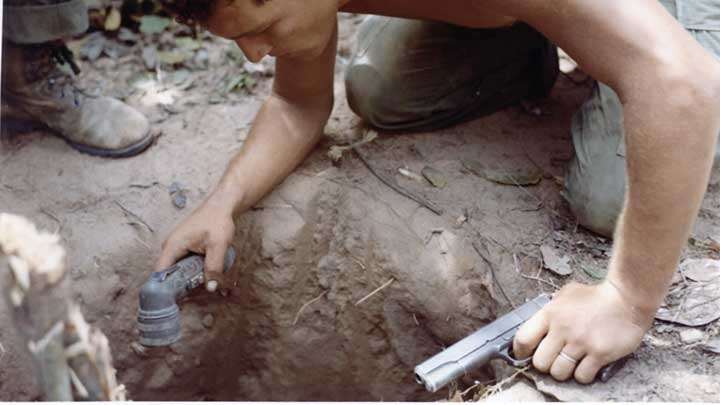 A “Tunnel Rat” of the 25th Infantry Division prepares to enter a VC tunnel near Cu Chi in the Hobo Woods during Operation Cedar Falls in January, 1967.