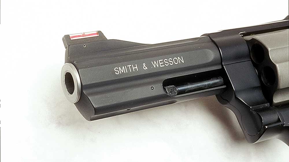gun barrel metal steel black revolver cylinder shooting white background