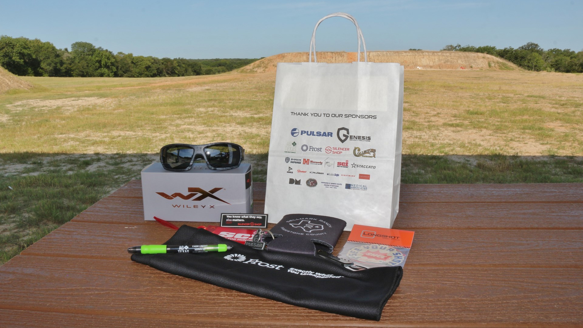 Sellmark Ranch outdoor shooting range table shown with swag sponsors gear