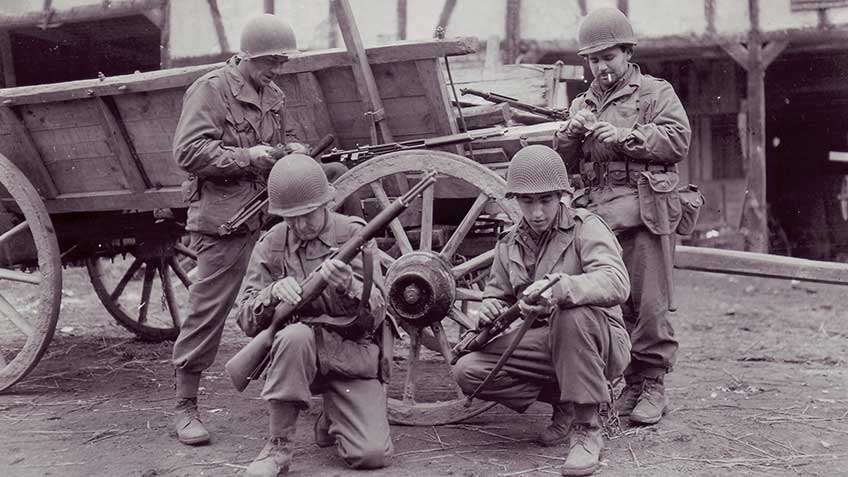 GIs of the 78th Infantry Division cleaning their rifles (three men carry the M1 Garand rifle, and the man at bottom right has a M1 Carbine) before they cross the bridge at Remagen.