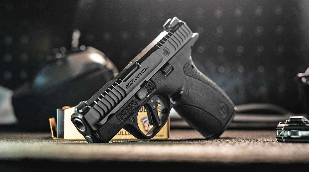 Smith & Wesson Bodyguard 2.0 on a shooting range table.