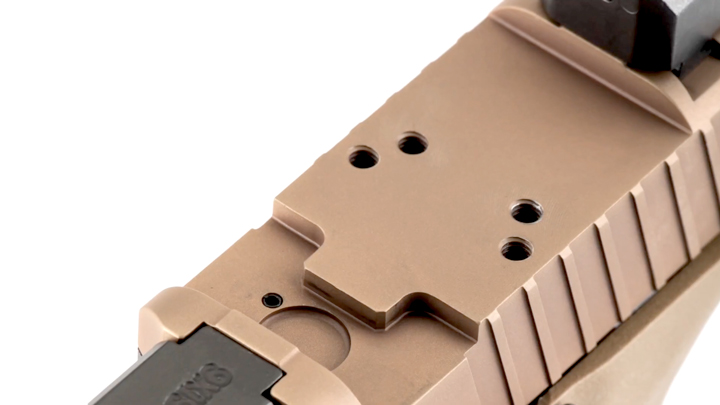 Close-up view of pistol slide and machining cuts to accommodate optics.