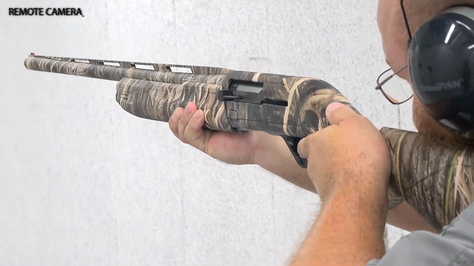 Shooting the Winchester SX4 Left Hand Waterfowl Hunter shotgun man earmuffs glasses indoors target range
