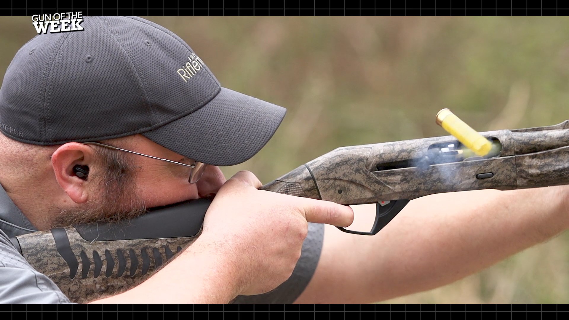Man wearing ballcap outdoors right-side view shooting benelli sbe3 20 gauge shotgun yellow shotshell action recoil smoke