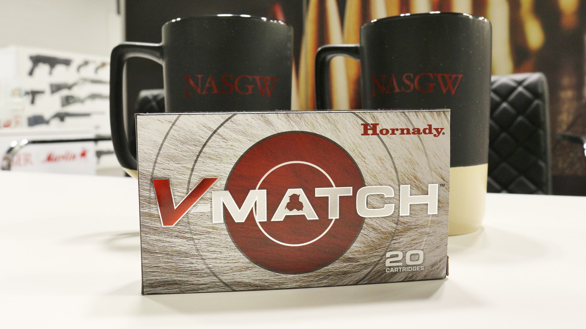 Hornady V-Match box of ammunition red circle bullseye ammo carton NASGW mugs background